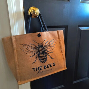 Brown sturdy canvas tote bag with black handle featuring a bee The Bee’s Knees